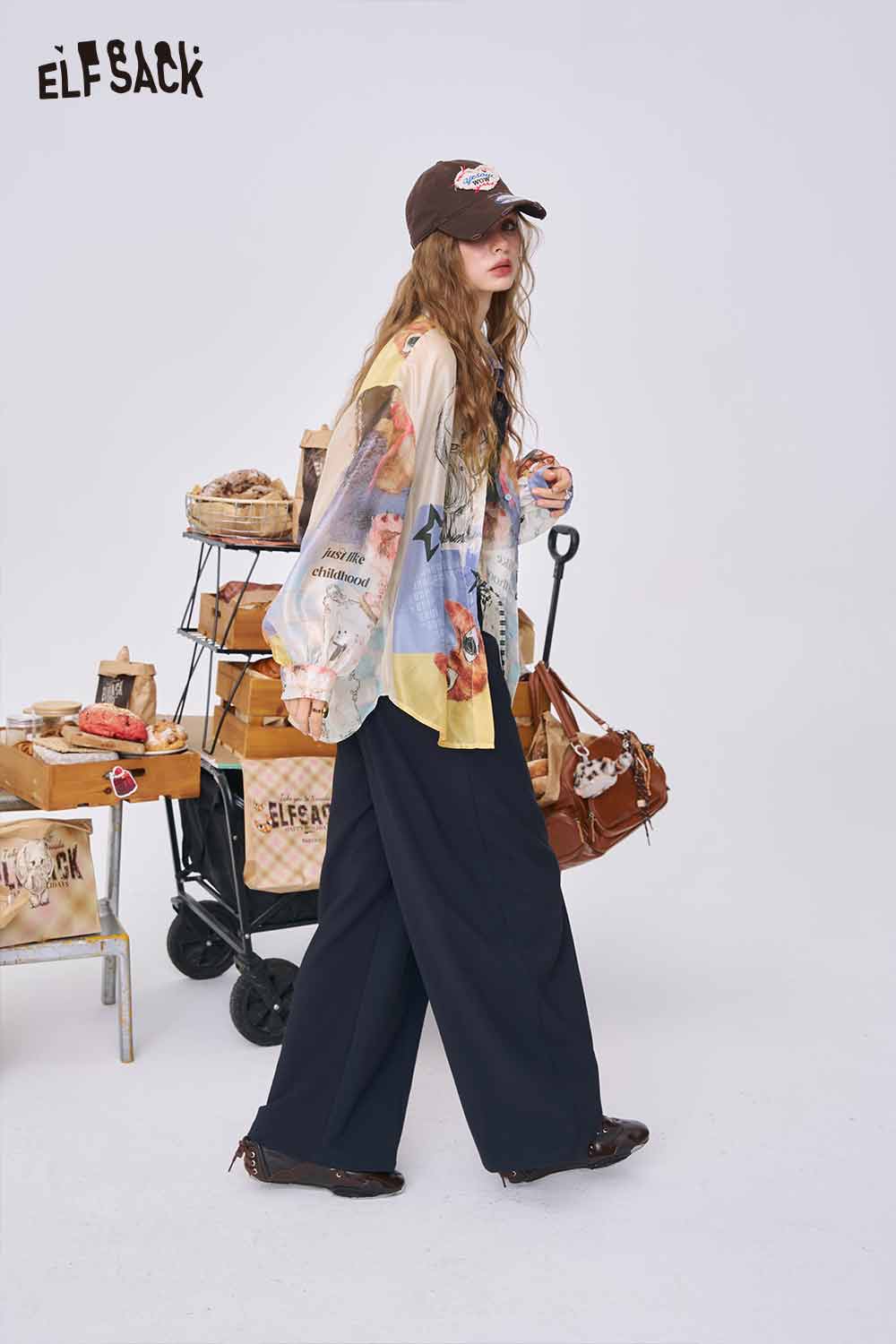 ELFSACK women wearing all over print long sleeve shirt styled with wide leg pants and brown cap