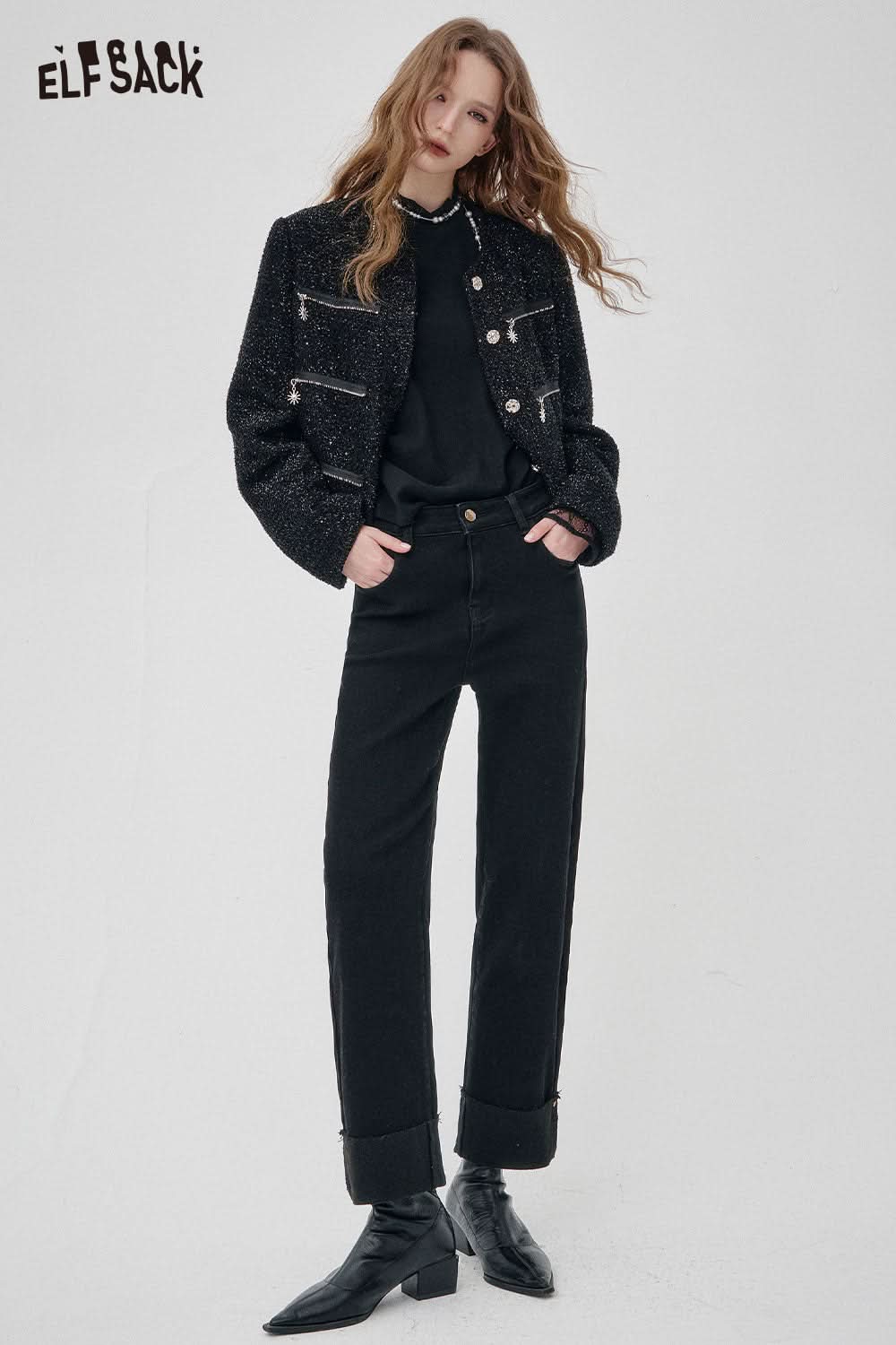 Trendy model wearing a stylish contrast lace knit top for women paired with black jeans and boots