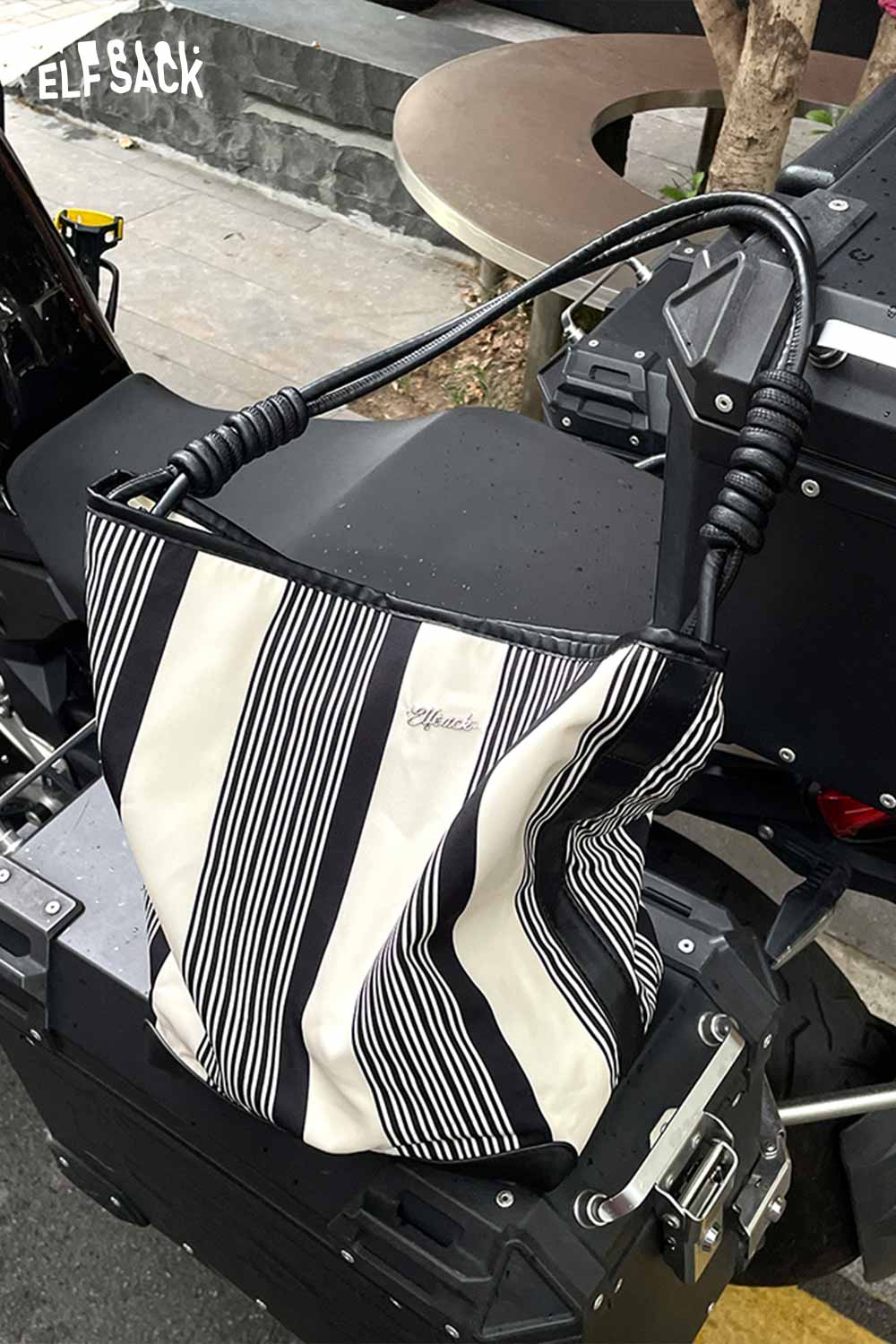 ELFSACK contrast stripe canvas tote bag featuring a stylish black and white design