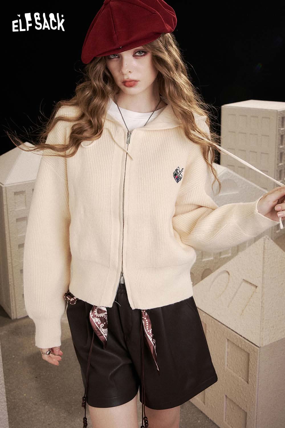 ELFSACK crown embroidered knit sweater in cream with zip closure and stylish design