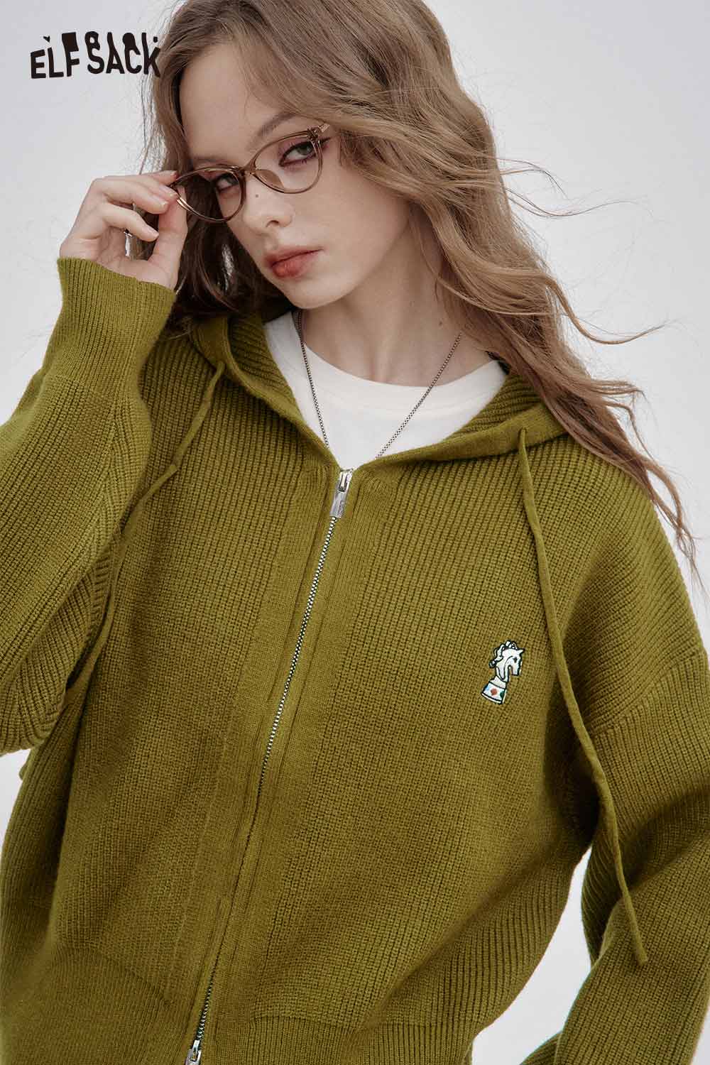 Olive green crown embroidered knit sweater by ELFSACK with zip-up design and hoodie features