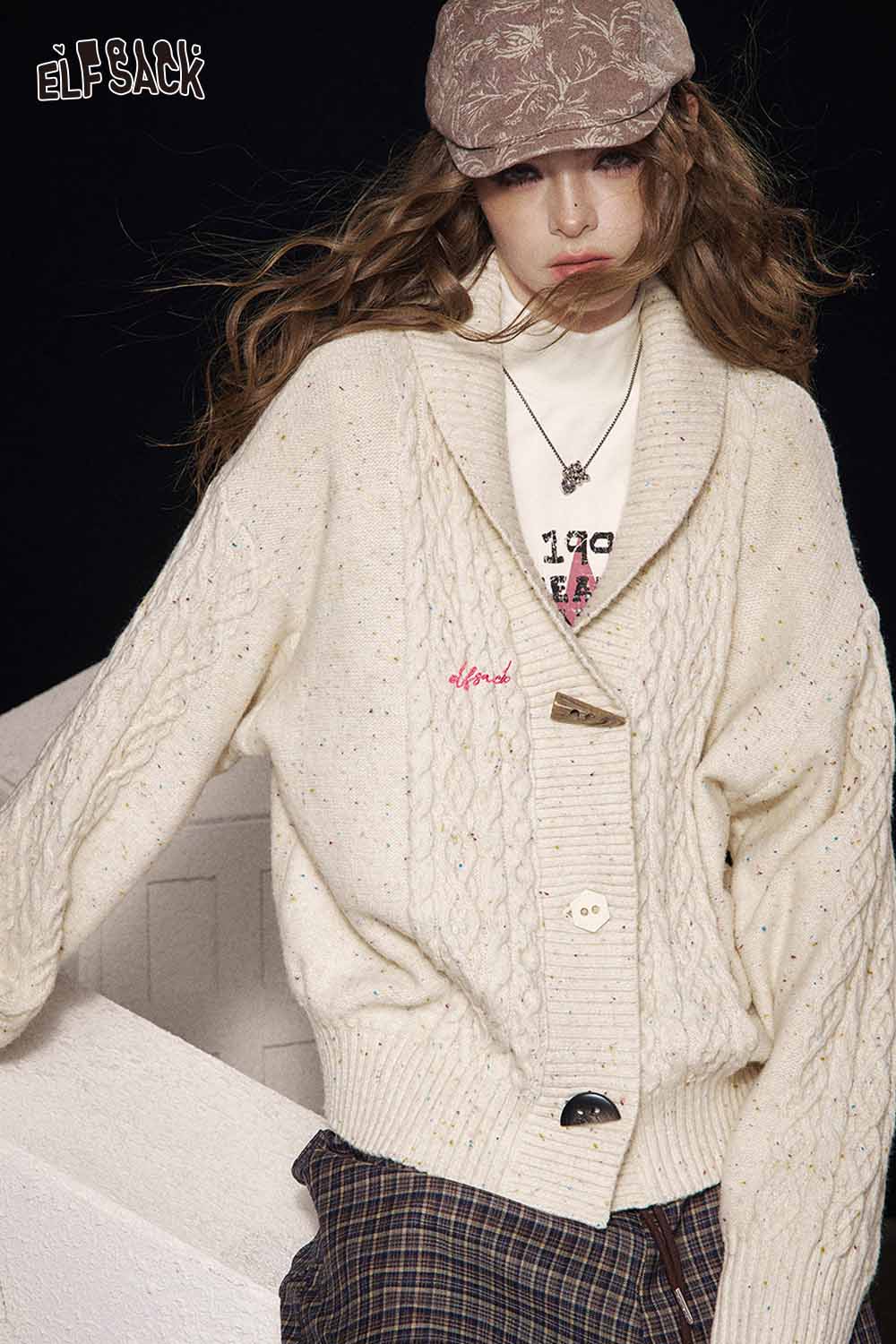 ELFSACK irregular button knit sweater in cream with a cozy oversized fit for stylish layering