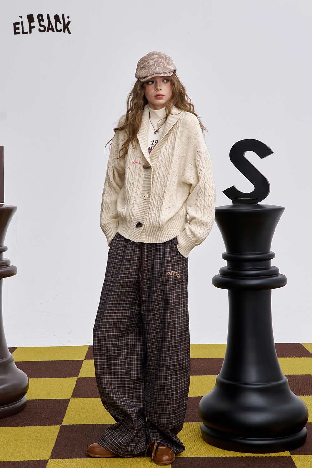 ELFSACK irregular button knit sweater in cream with a stylish cabling pattern and relaxed fit