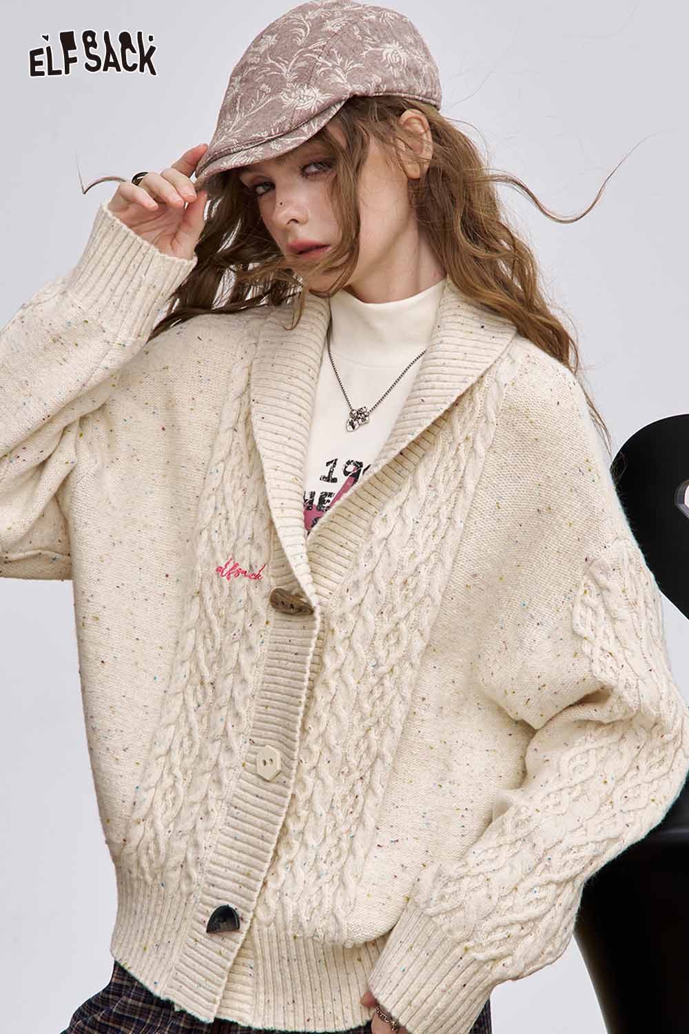 ELFSACK irregular button knit sweater in cream with a cozy oversized fit and unique texture