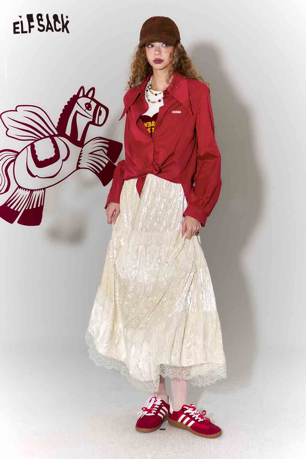 ELFSACK loose fit pointed collar blouse in red paired with a cream skirt and stylish sneakers