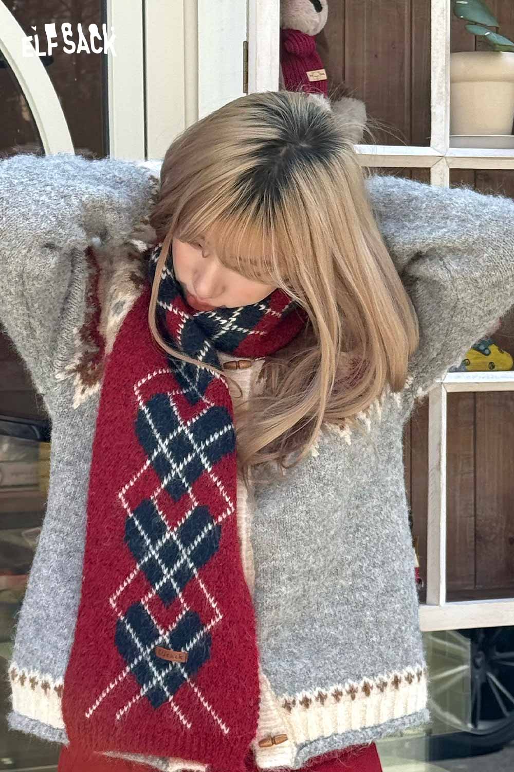 ELFSACK minimalist diamond pattern scarf in red and navy wrapped stylishly around a woman