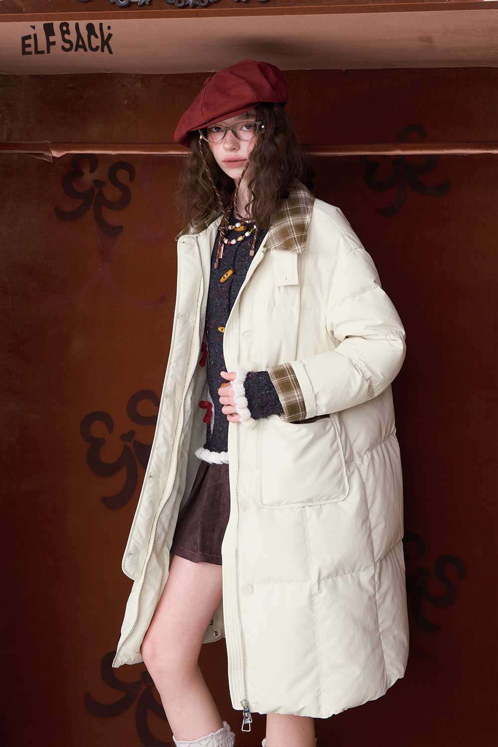 ELFSACK minimalist long down coat for women in cream color, featuring a relaxed fit and stylish design