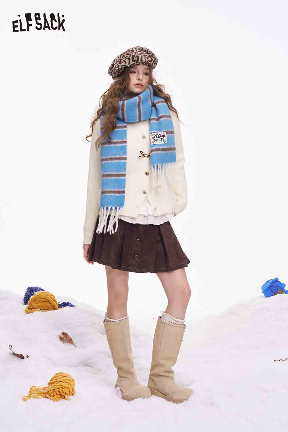 ELFSACK preppy striped fringe scarf showcased with a stylish outfit for a trendy winter look