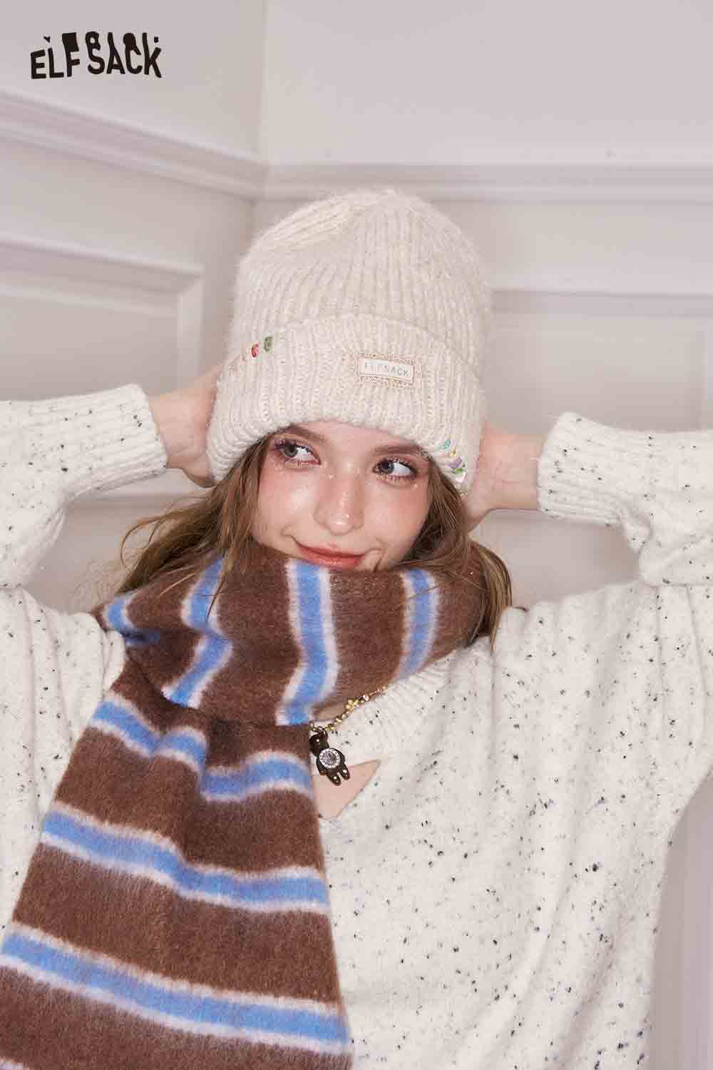 Cozy ELFSACK preppy striped fringe scarf paired with a warm knit hat for stylish winter wear