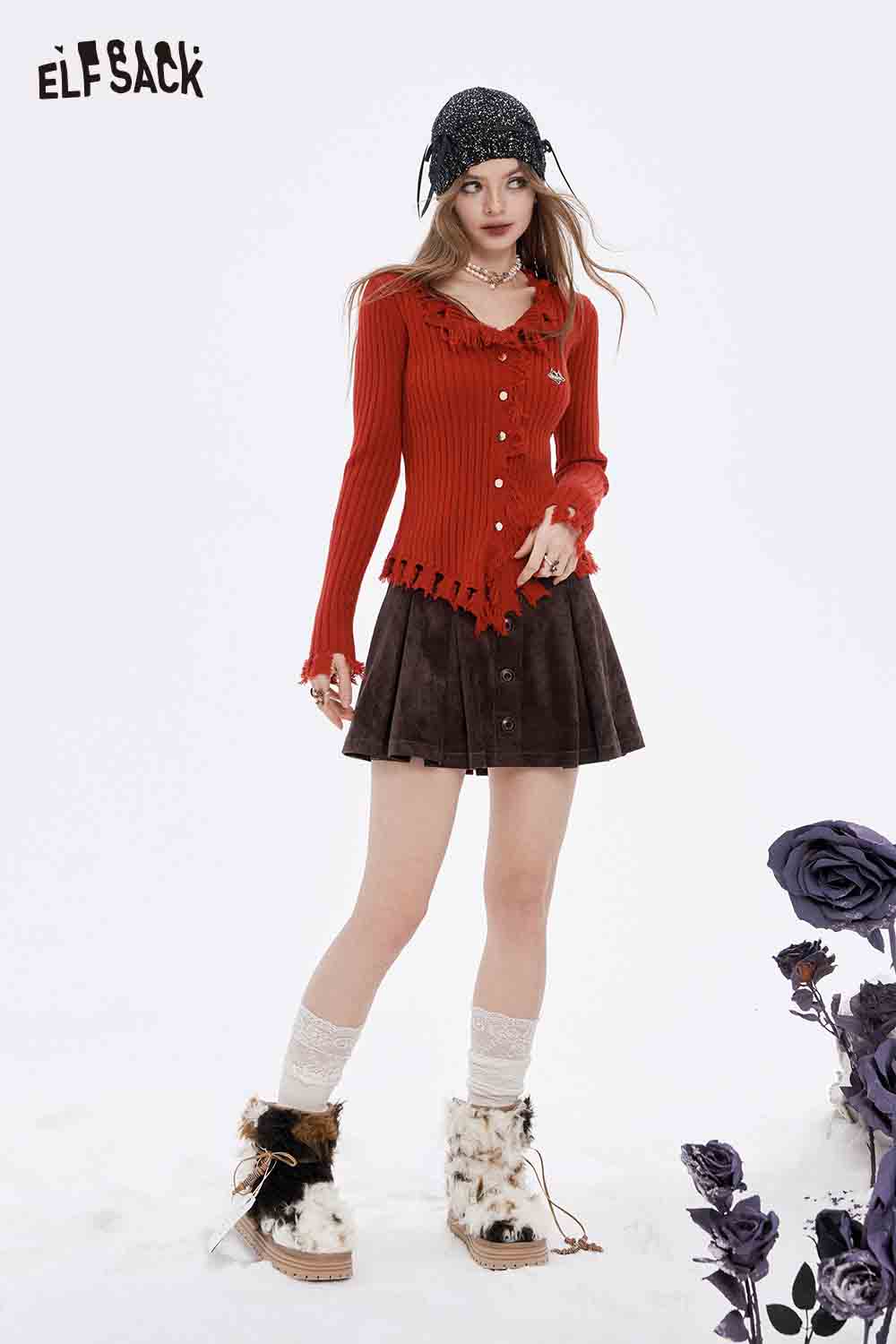 Stylish ELFSACK slim fit heart logo knit sweater in red, paired with a brown skirt and cozy boots
