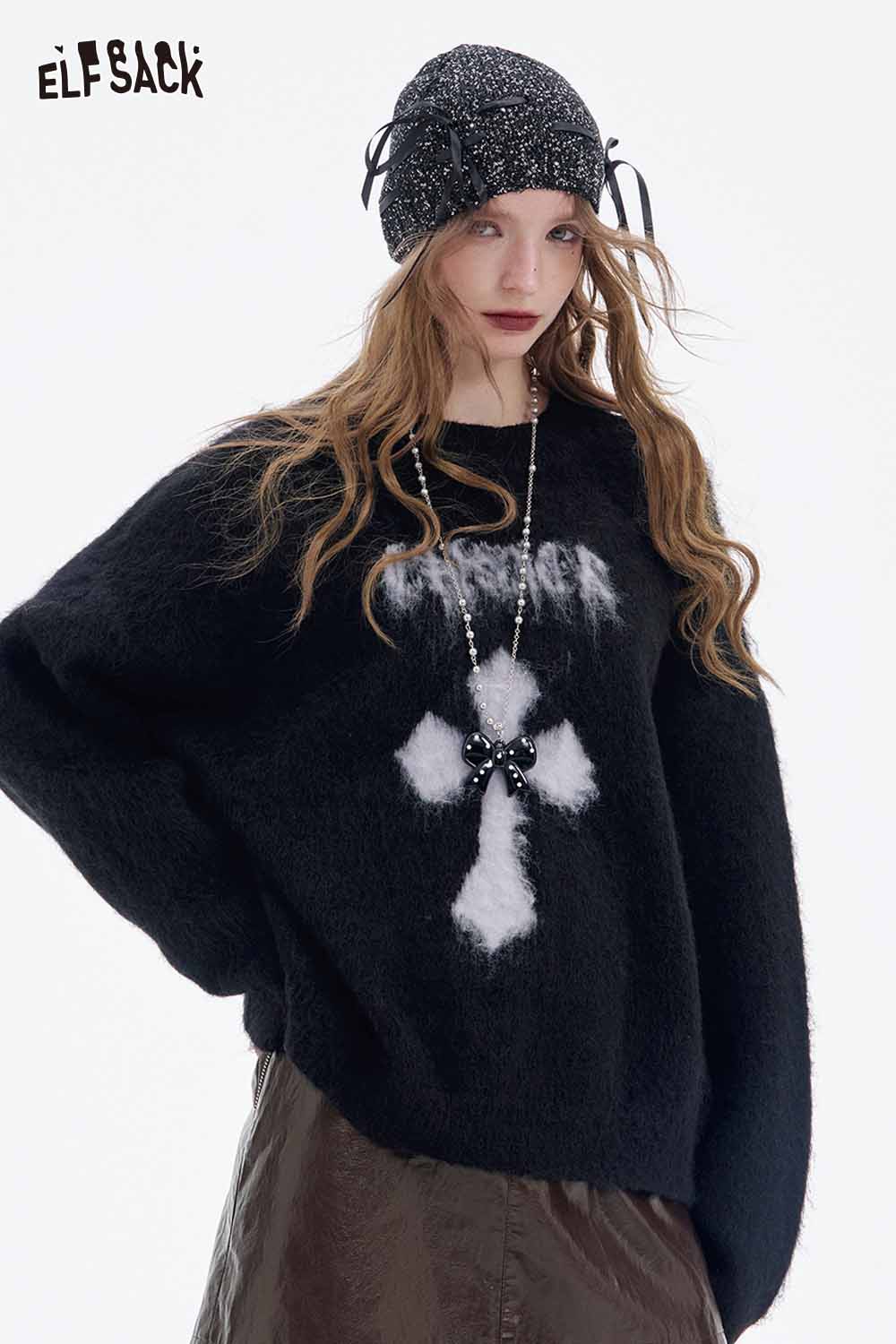 ELFSACK soft shiny leather skirt paired with a cozy black sweater and stylish accessories