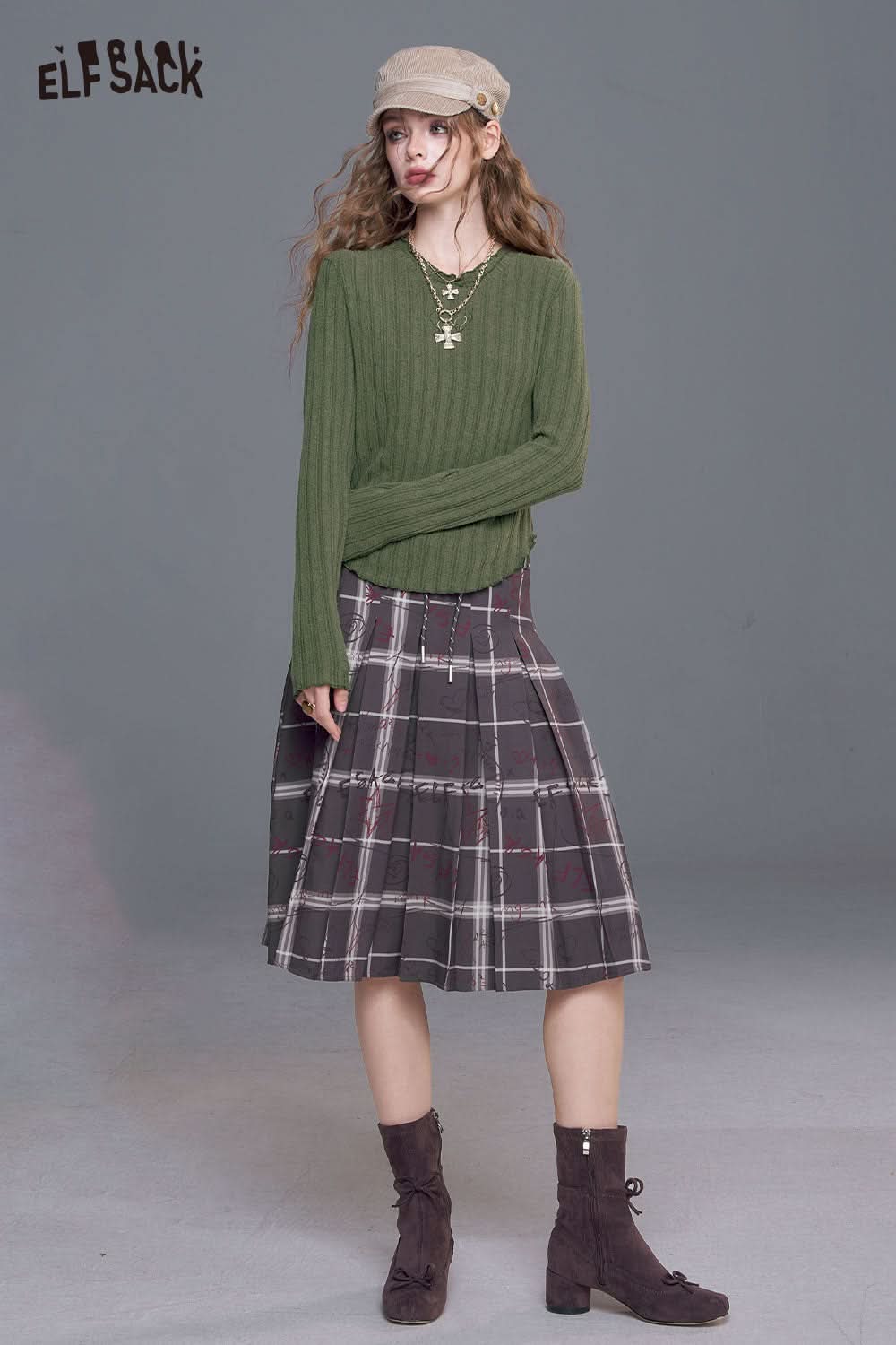 ELFSACK women's stretch knit top in green, paired with a plaid skirt and stylish accessories