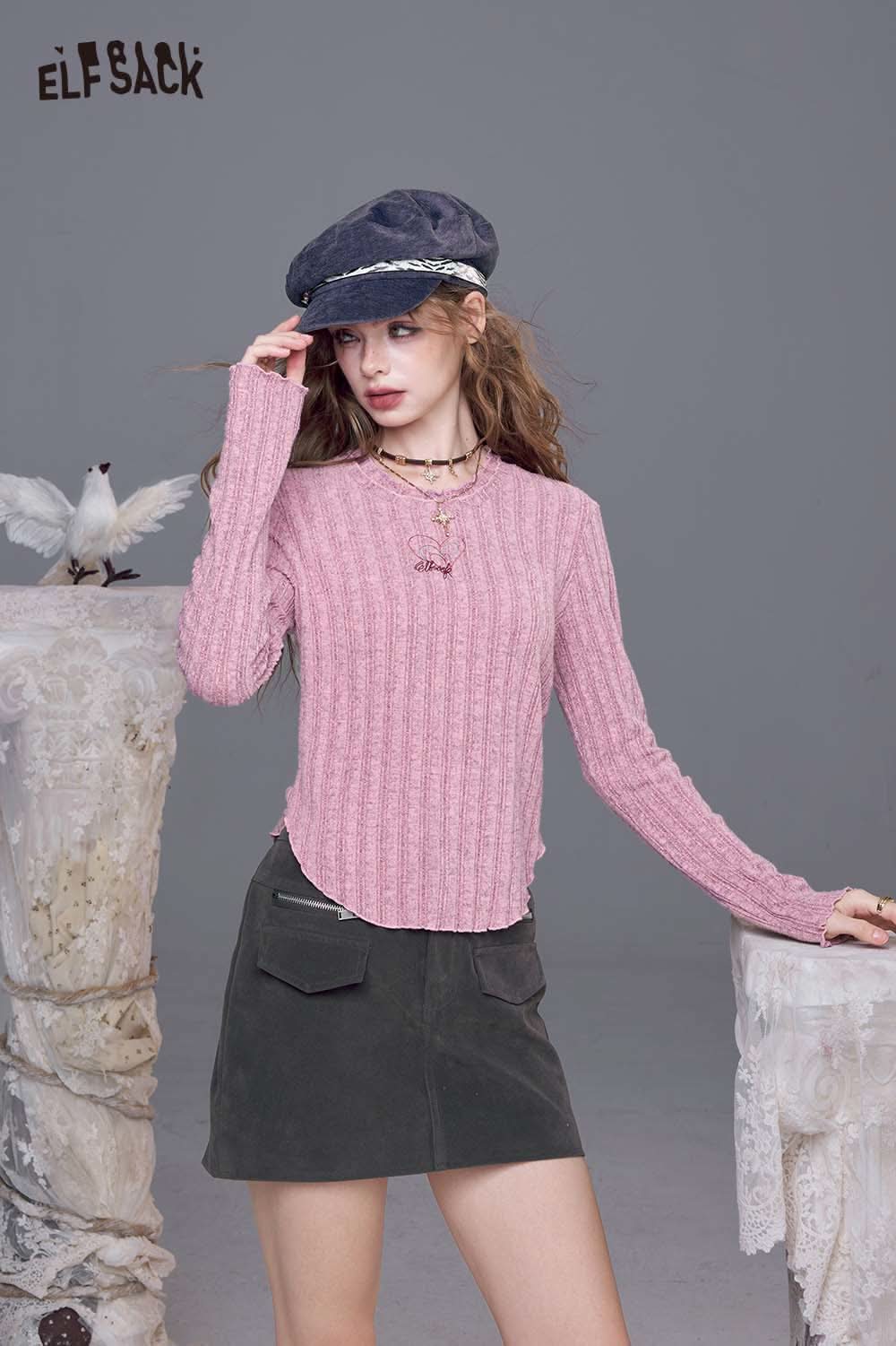 ELFSACK women's stretch knit top in pink with ribbed texture and long sleeves, styled with a skirt