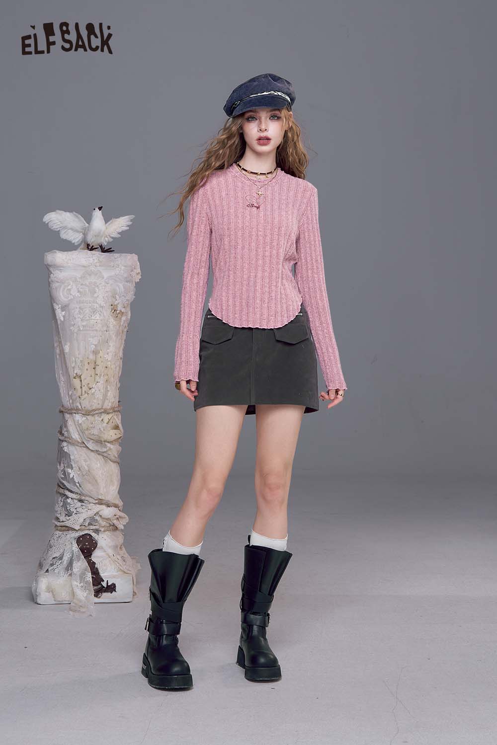ELFSACK women's stretch knit top in pink, styled with a black skirt and boots for a trendy look