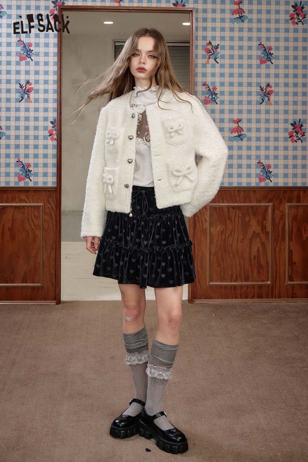 ELFSACK wool blend bow detail coat in white, styled with a black skirt and knee-high socks