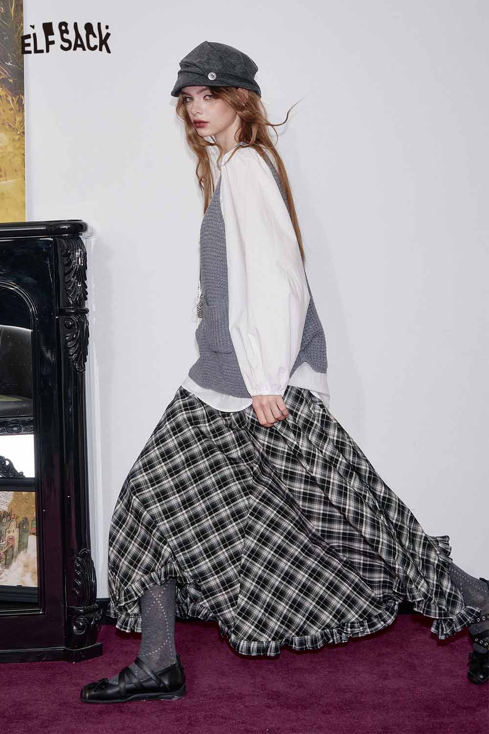 ELFSACK wool blend checkered skirt with a flowy design, styled with a cozy sweater and hat