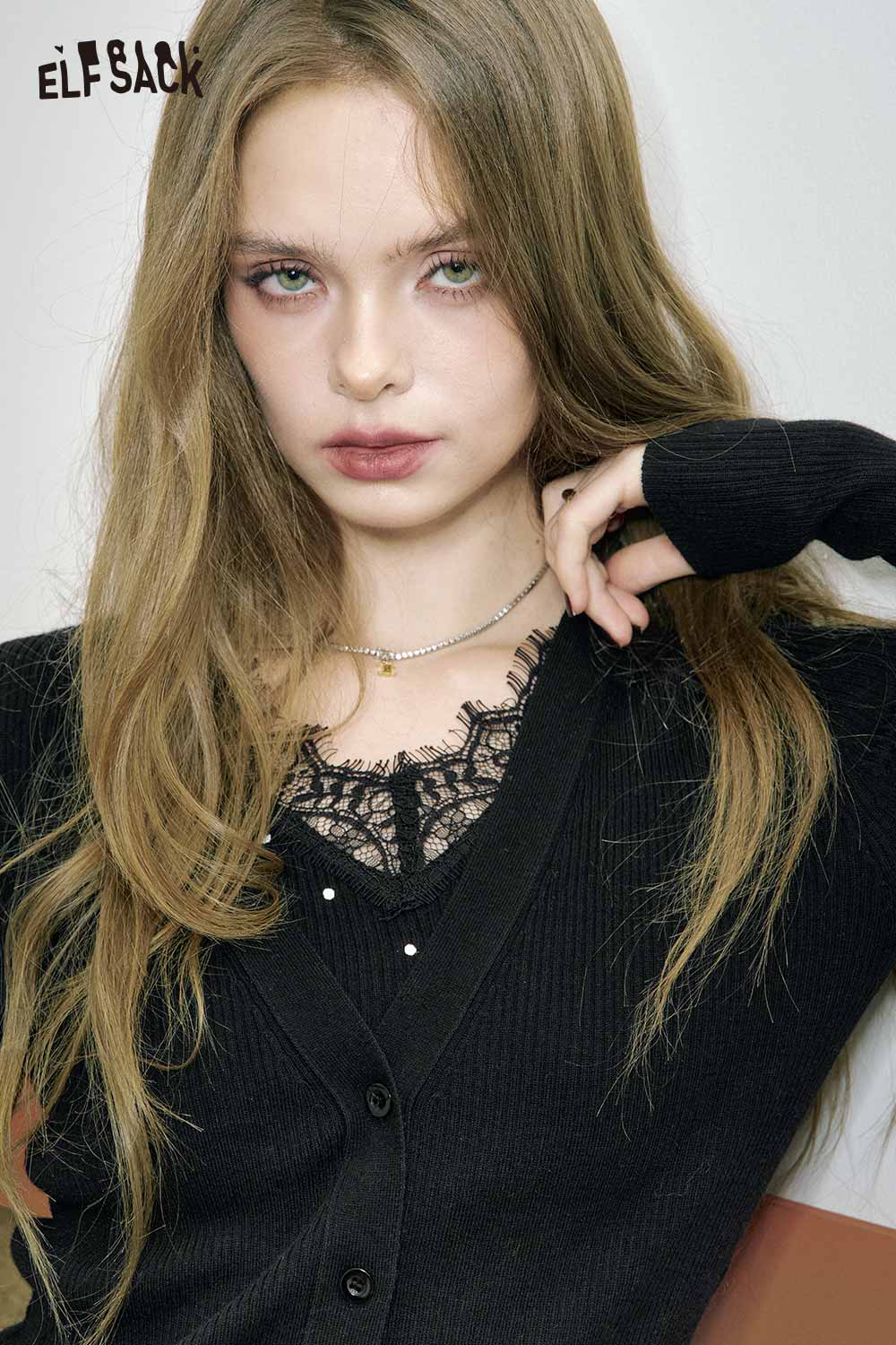 ELFSACK wool blend lace knit top in black with delicate lace detailing and a stylish cut