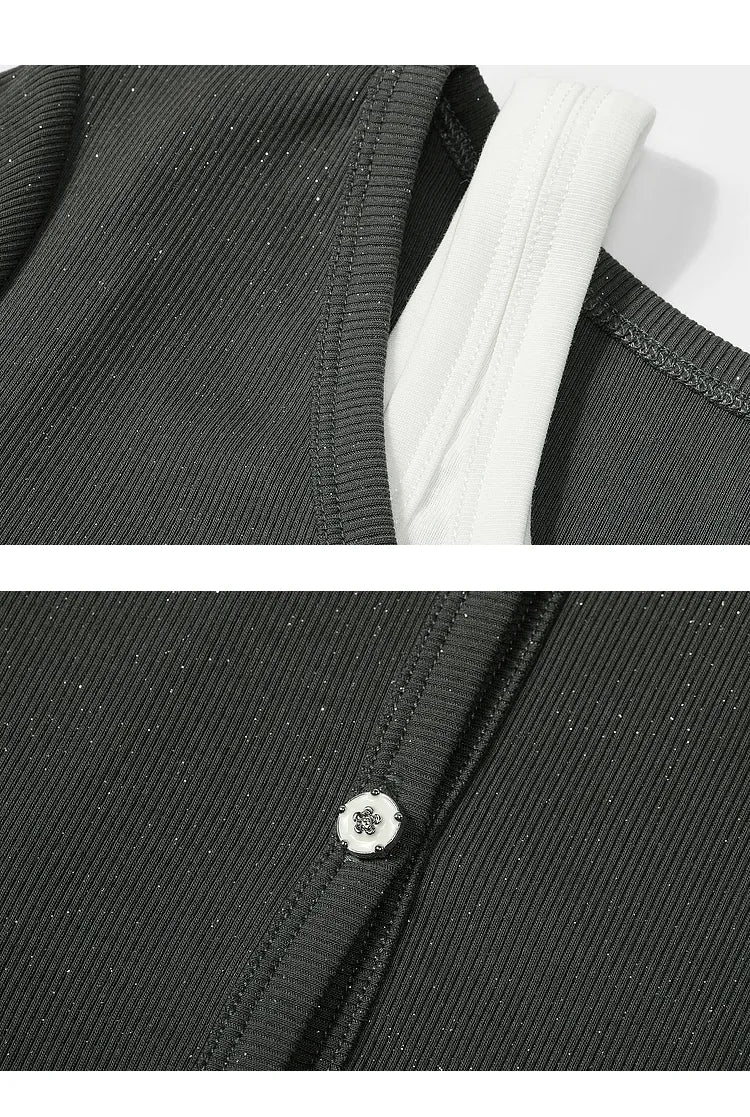 Close-up of ELFSACK Y2K Layered black ribbed T-shirt showing white inner layer and button detail