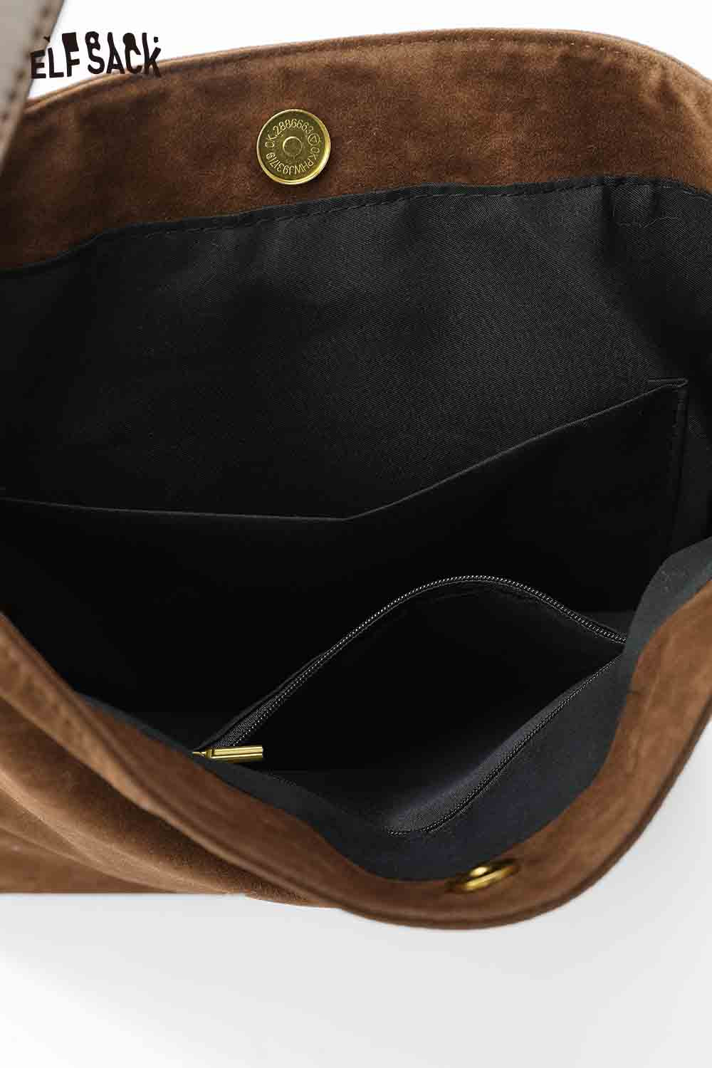 Interior view of the ELFSACK vintage bohemian tote bag with multiple pockets and a zippered compartment