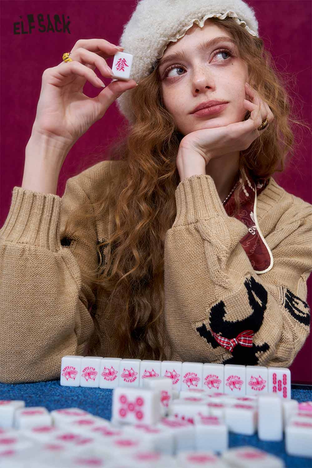 ELFSACK vintage bow jacquard cardigan in a cozy setting with playful decor