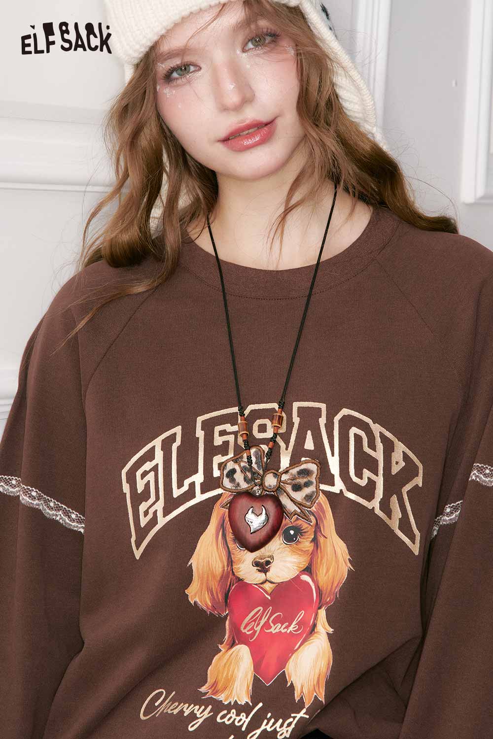 ELFSACK Vintage Heart Pendant Necklace worn with a brown sweatshirt featuring a playful dog design