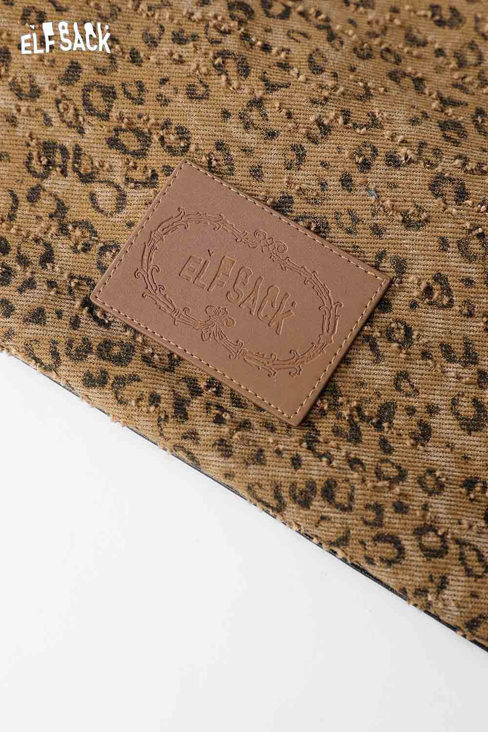 Close-up of ELFSACK vintage leopard shoulder bag showcasing its unique print and brand logo