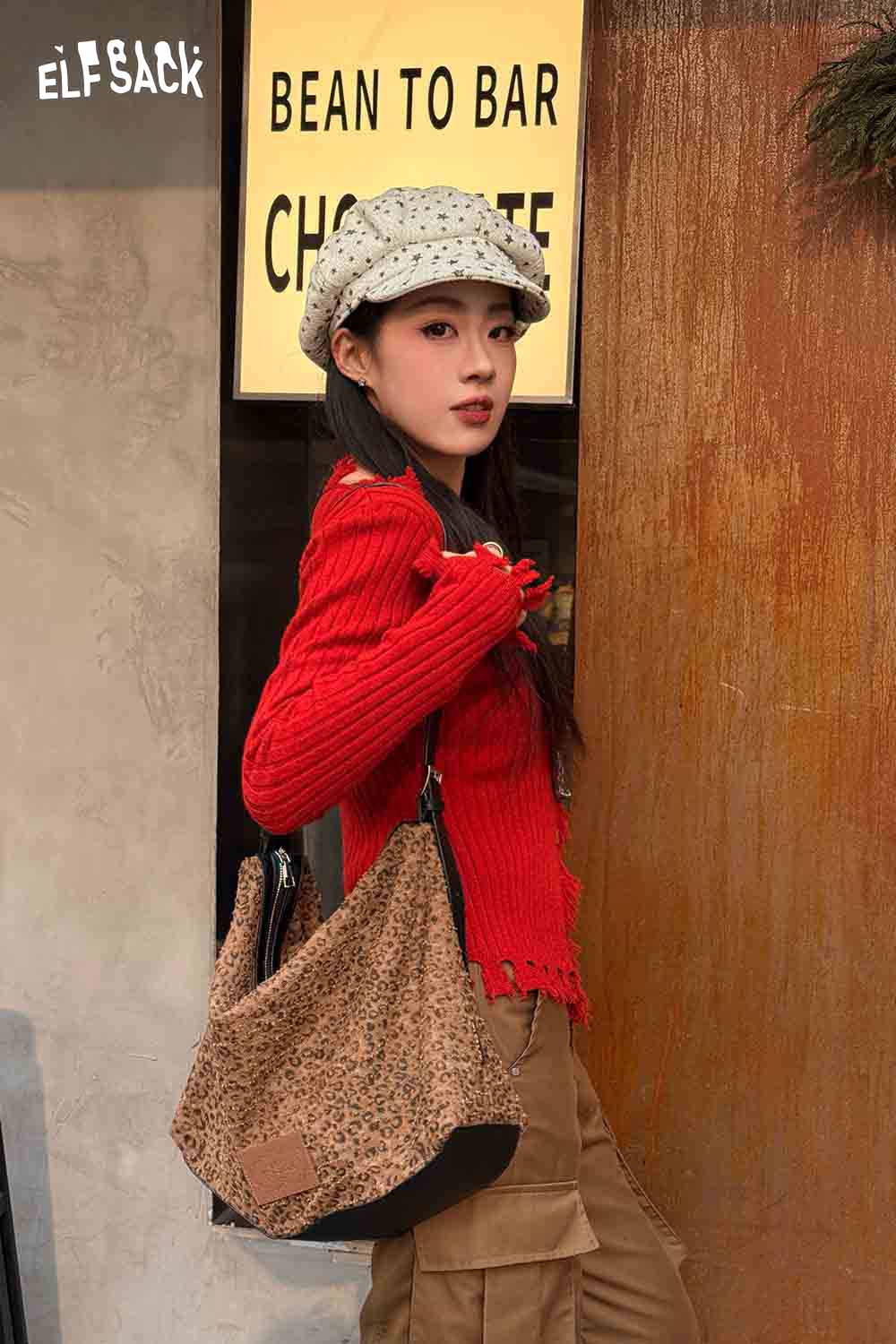 ELFSACK vintage leopard shoulder bag featured with a stylish outfit in a chic urban setting