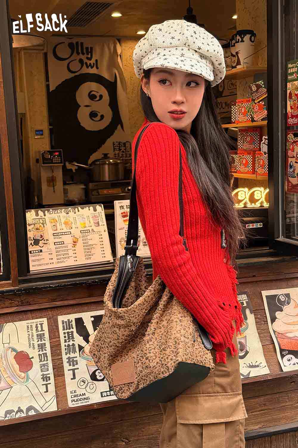 
                  
                    ELFSACK vintage leopard shoulder bag paired with a red sweater for a stylish urban look
                  
                
