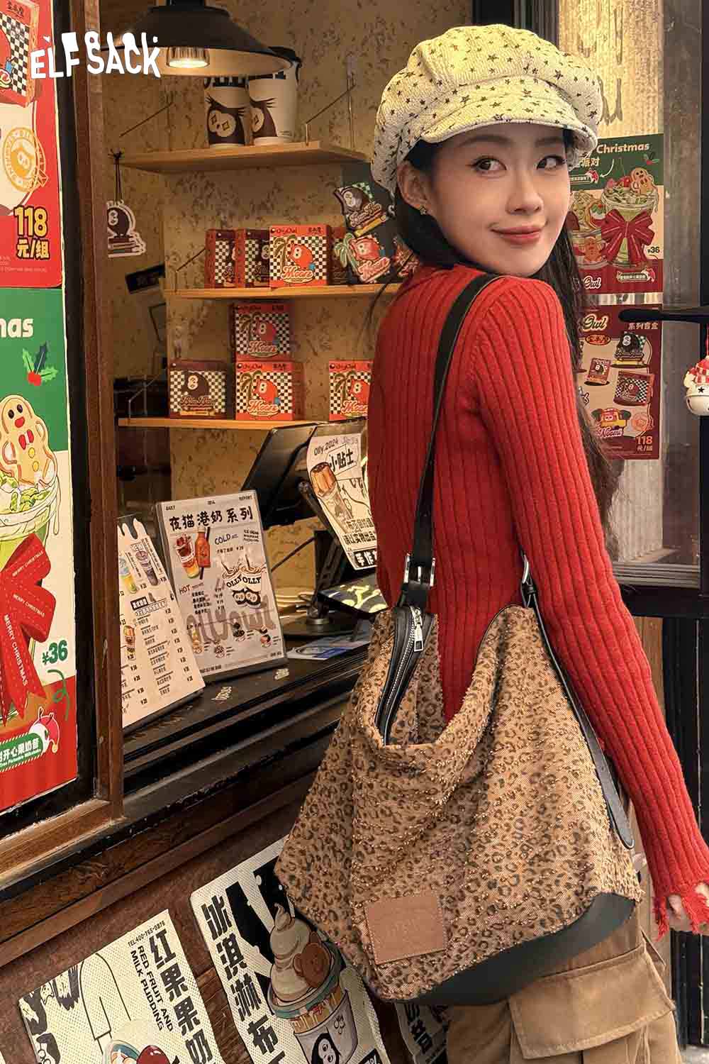 
                  
                    Stylish ELFSACK vintage leopard shoulder bag on model in a cozy cafe setting
                  
                