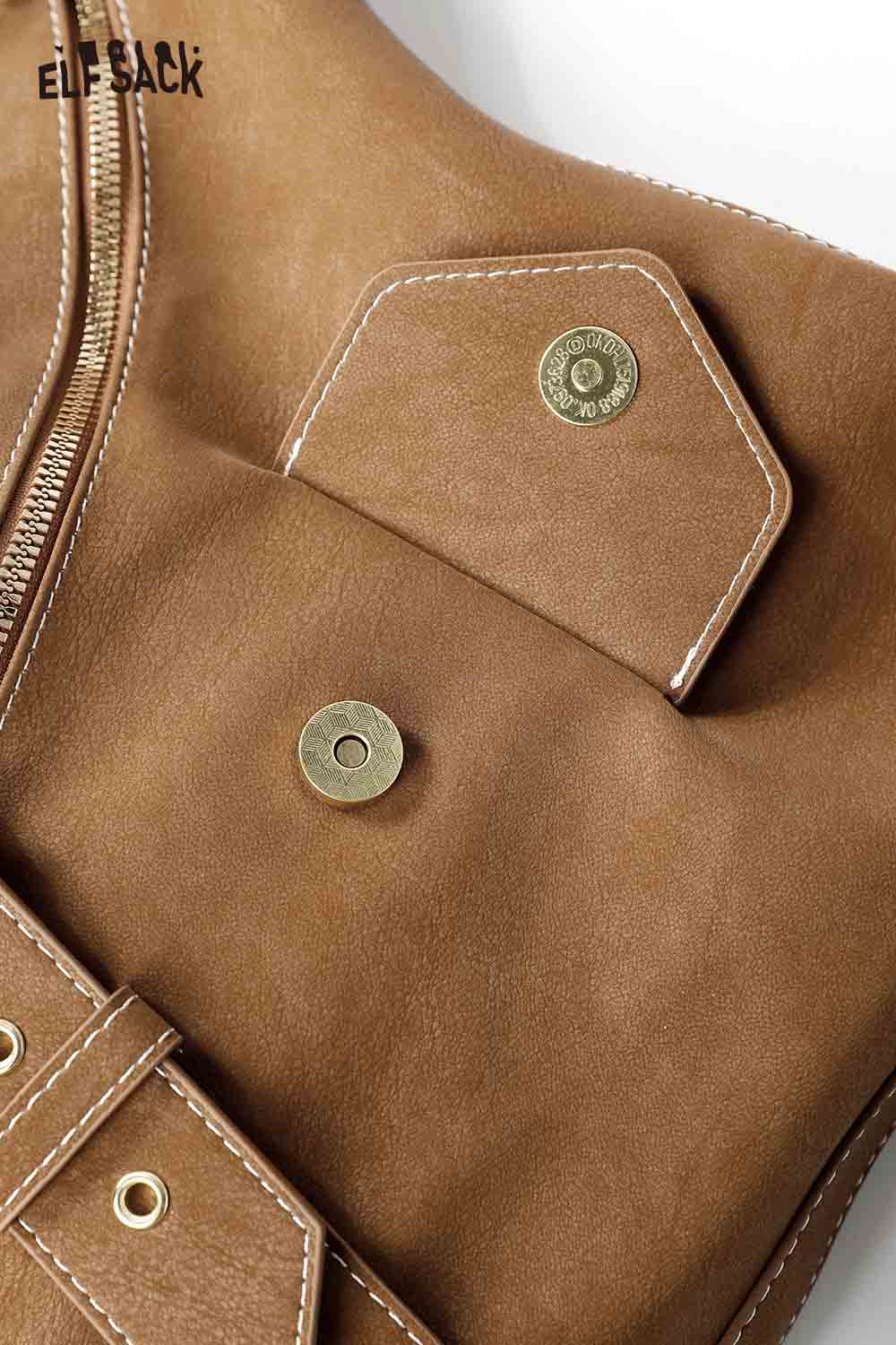 Close-up of vintage suede shoulder bag by ELFSACK with snap pocket and zipper detail