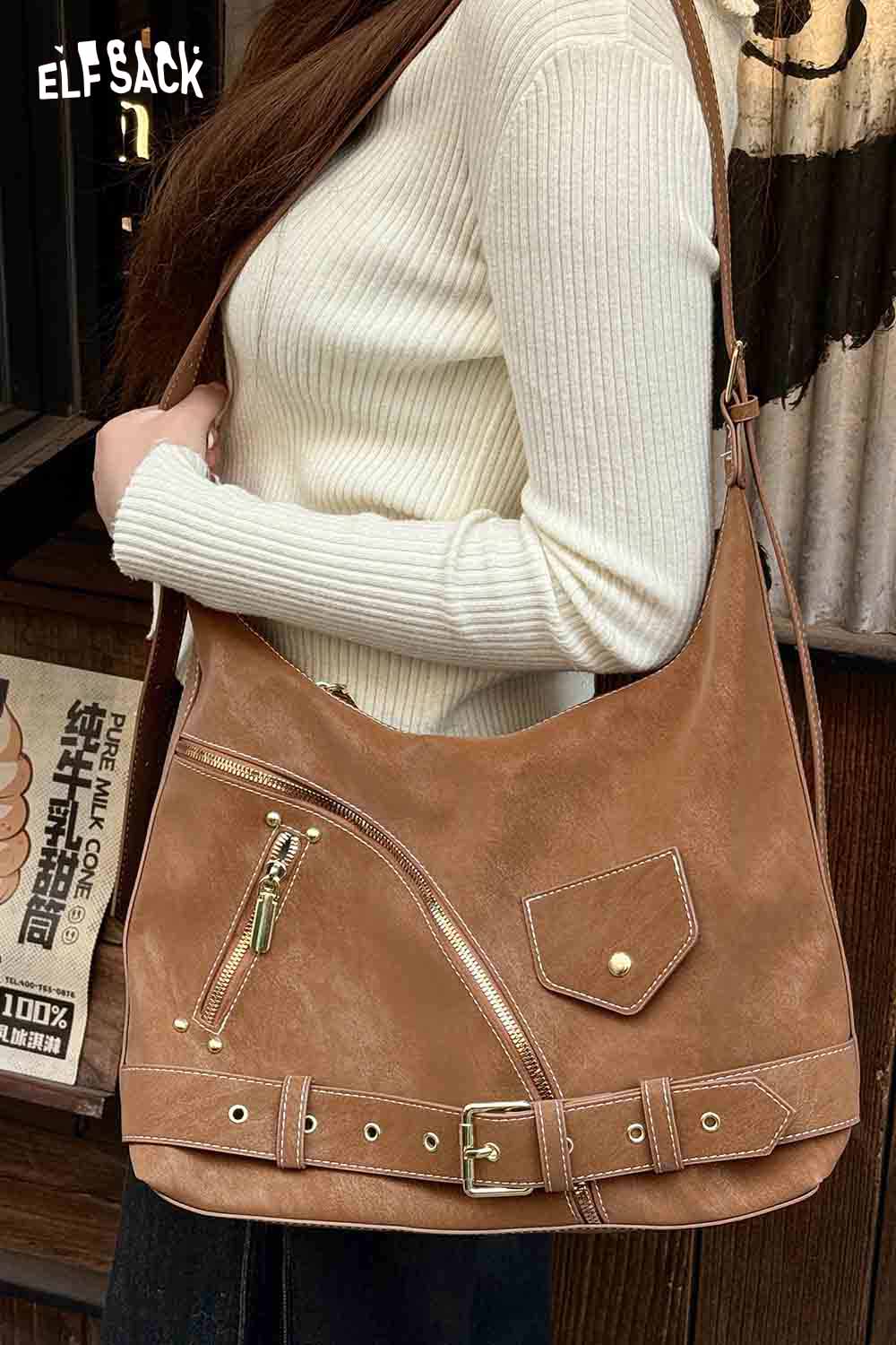 
                  
                    ELFSACK vintage suede shoulder bag featuring a stylish design and adjustable strap for daily use
                  
                