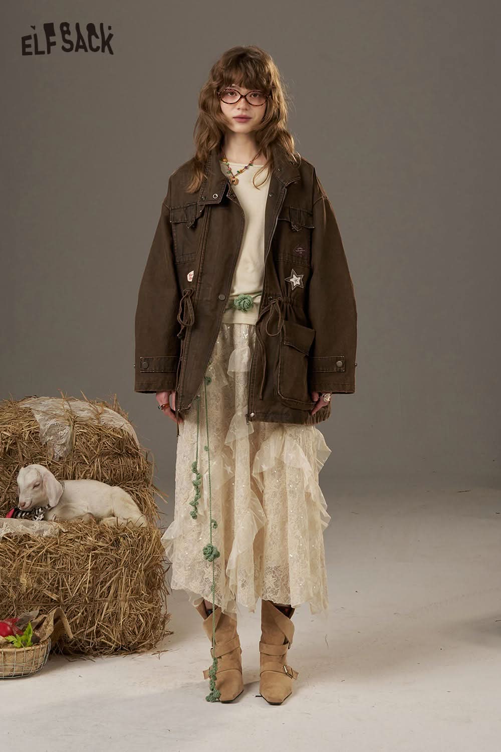 ELFSACK waist cinching long sleeve shirt styled with a brown jacket and layered skirt for a trendy look