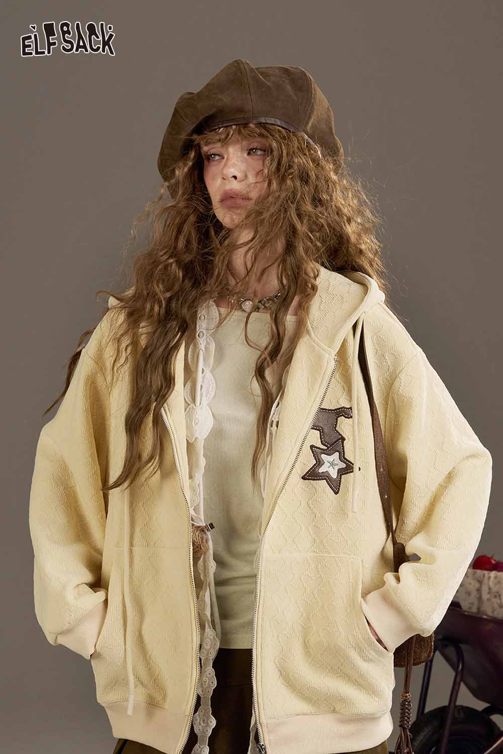 ELFSACK waist cinching long sleeve shirt with a stylish design in a cozy setting