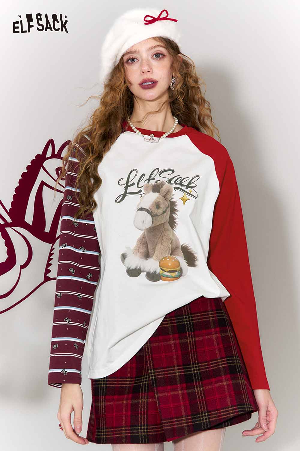Whimsical doll pony print t-shirt by ELFSACK featuring a playful design and colorful sleeves