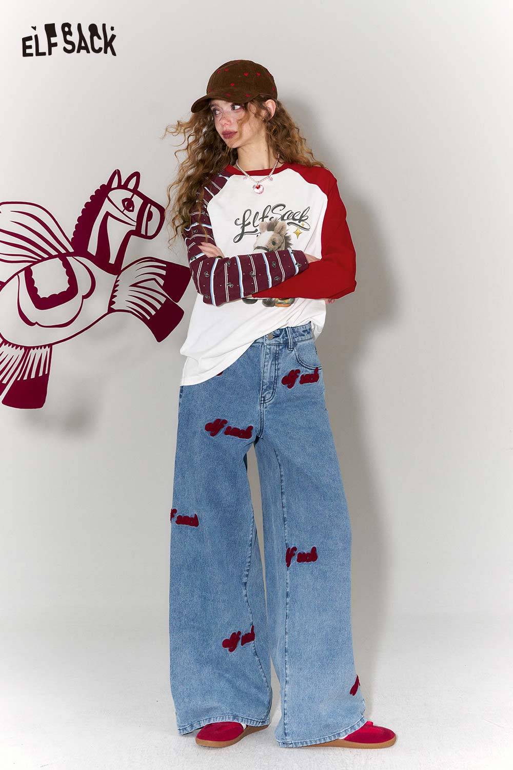 Whimsical doll pony print t-shirt from ELFSACK styled with trendy wide-leg jeans and a cap
