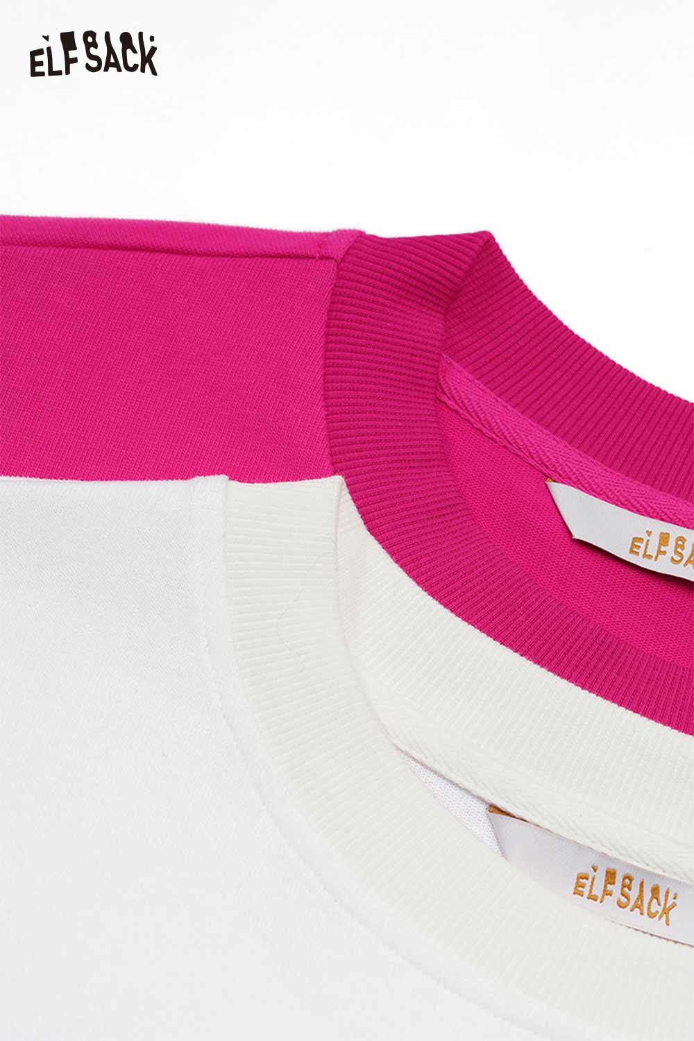 Close-up of ELFSACK whimsical pony sweatshirt featuring a pink and white color-blocked design