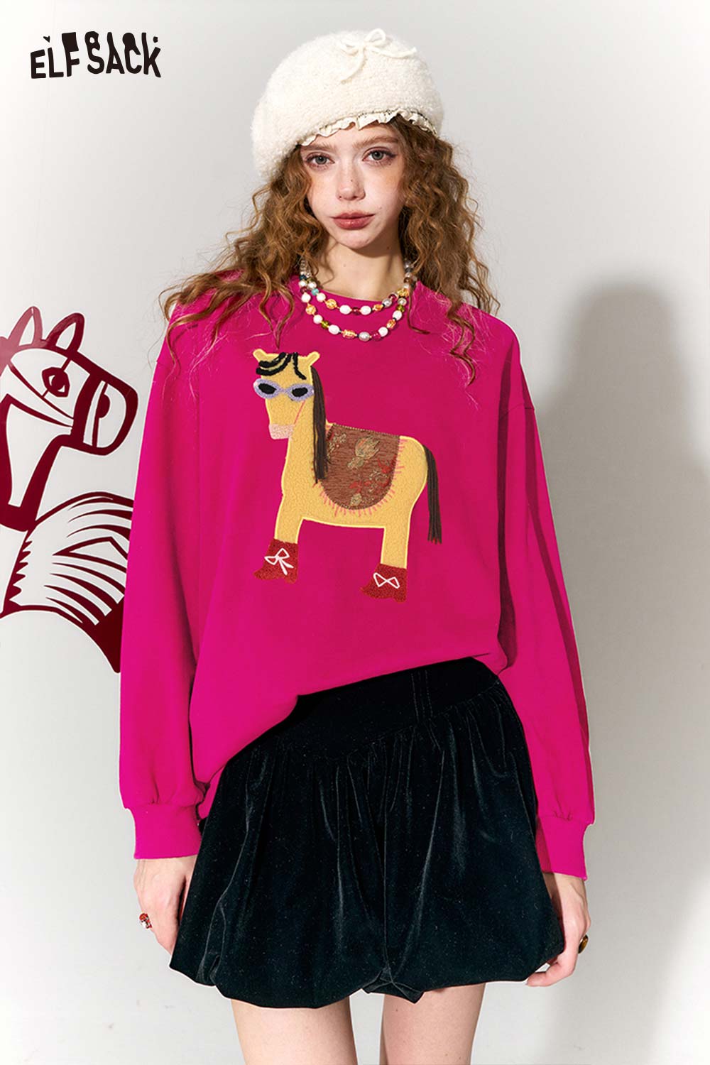 Whimsical pony sweatshirt in vibrant pink featuring a colorful horse graphic design