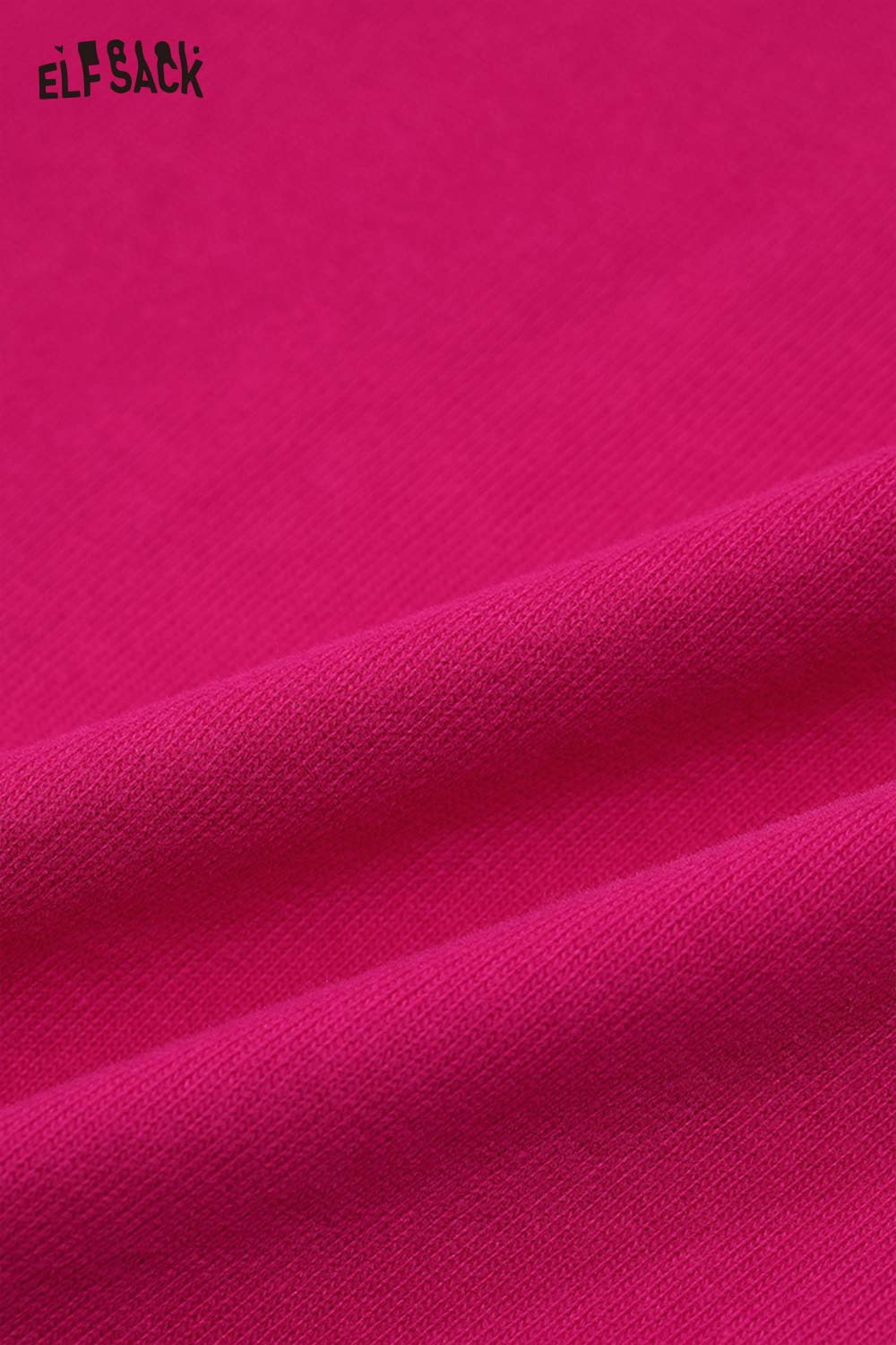Close-up of soft fabric detail of ELFSACK whimsical pony sweatshirt in vibrant pink color