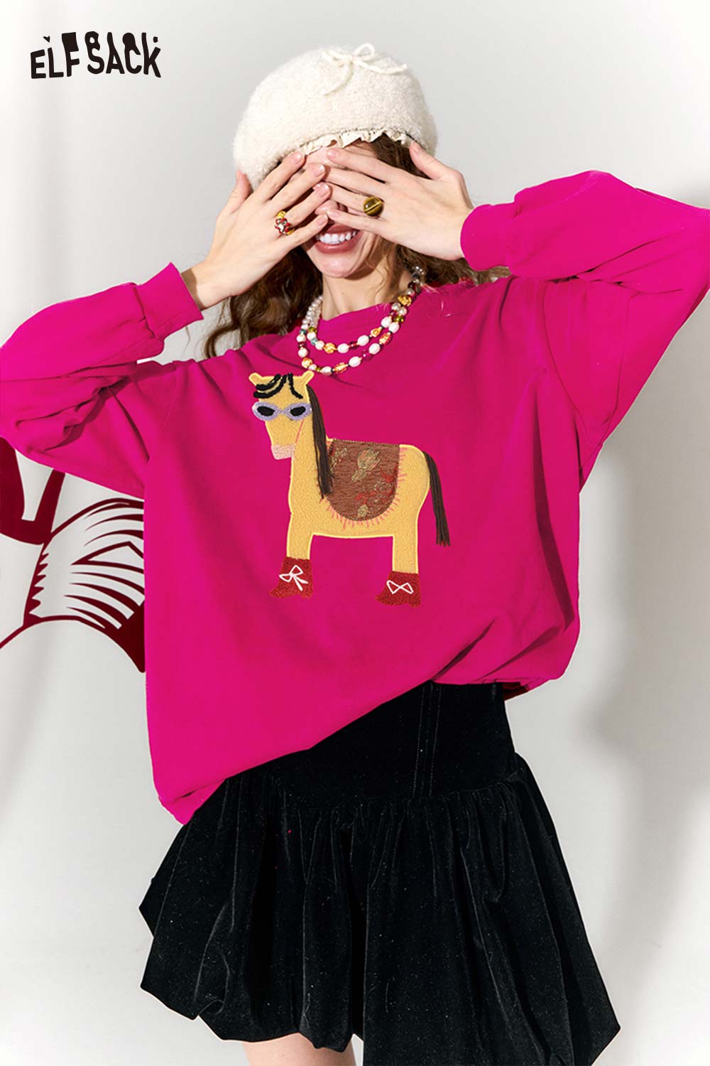 ELFSACK whimsical pony sweatshirt in vibrant pink featuring a playful horse graphic