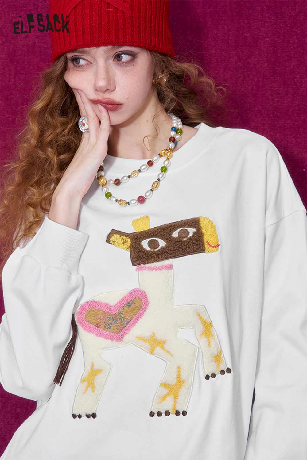 ELFSACK whimsical pony sweatshirt featuring a colorful pony design with star accents