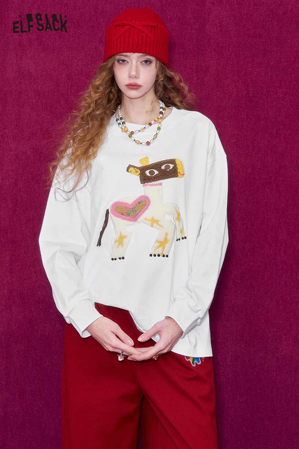 ELFSACK whimsical pony sweatshirt with colorful heart and star design on a white background