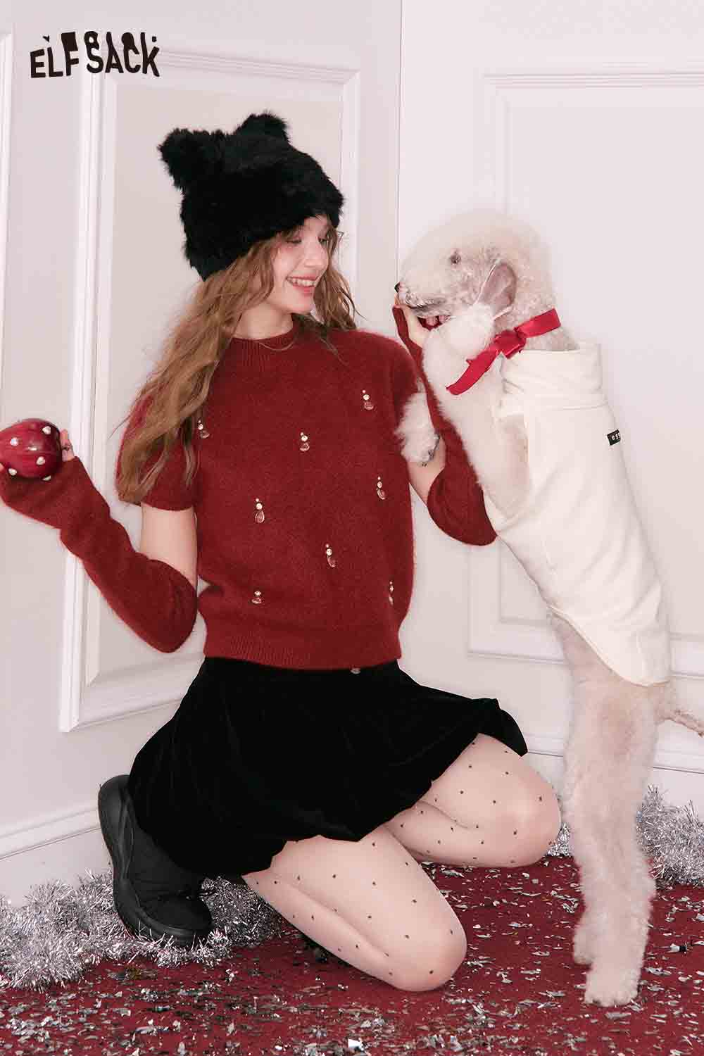 ELFSACK Christmas rhinestone sweater for women in red, styled with festive accessories and playful dog