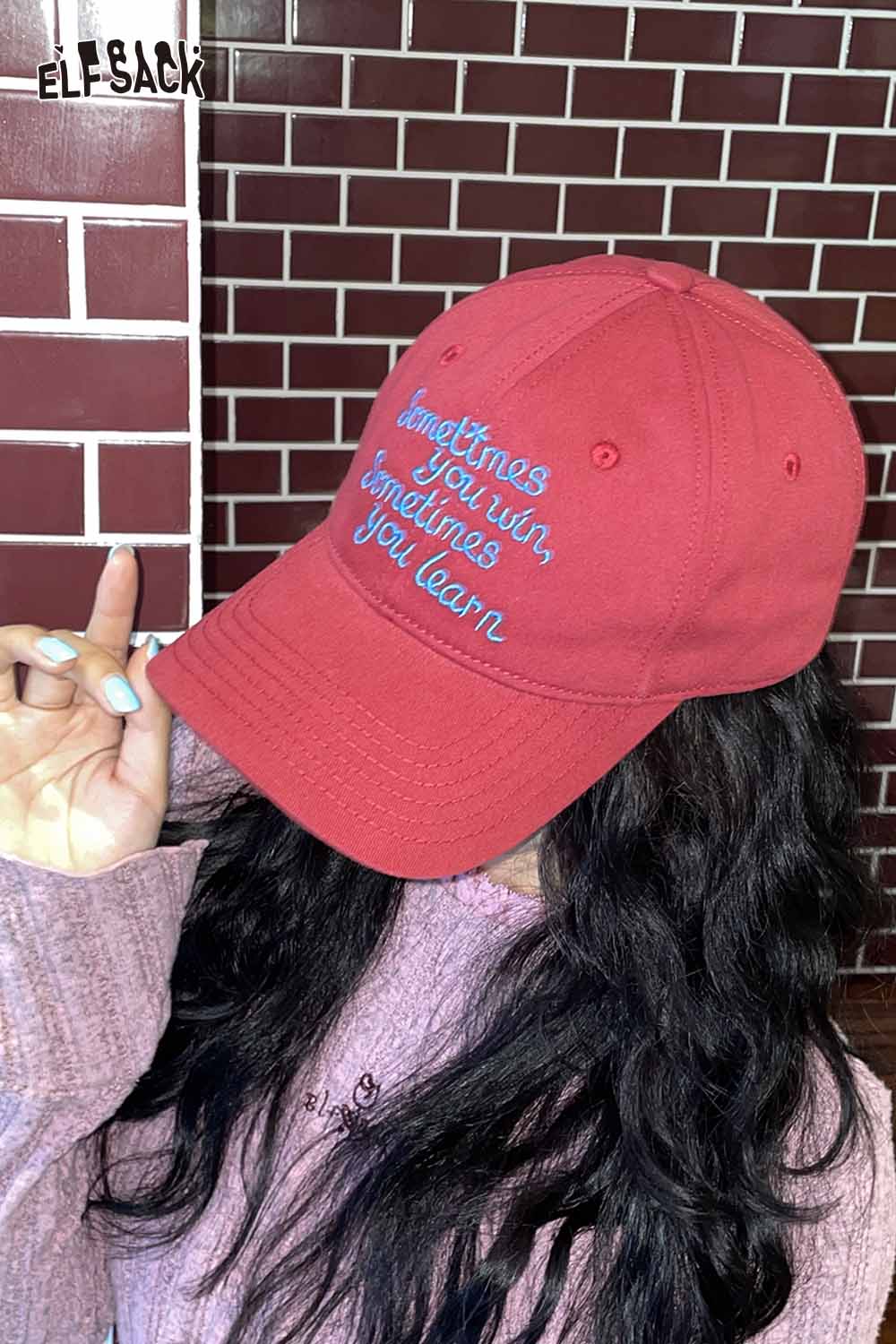 ELFSACK women's embroidered baseball cap in red with motivational quote stitched on the front