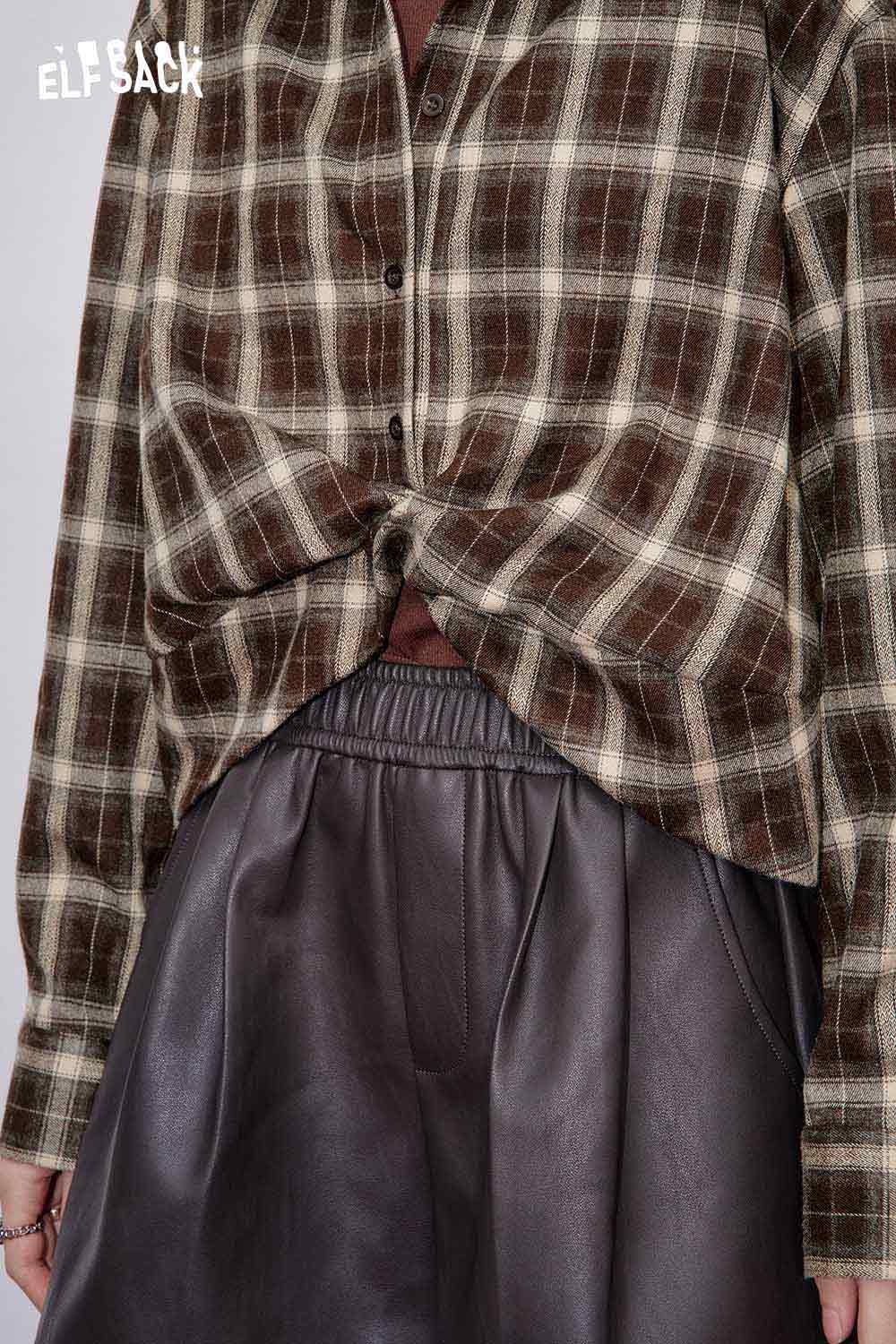 ELFSACK women's plaid button down shirt with a relaxed fit, styled over a leather skirt.