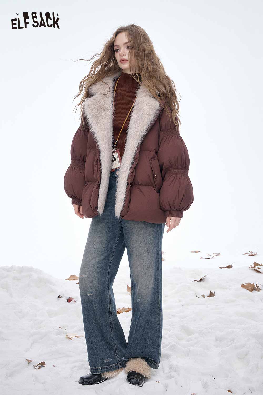 ELFSACK women's slim fit knit sweater paired with a stylish puffer jacket in a snowy setting