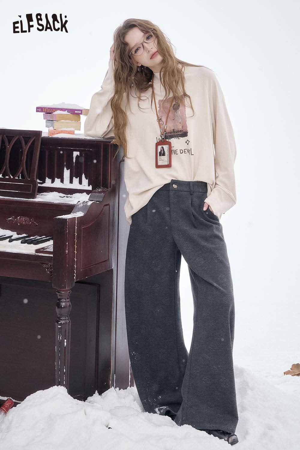 ELFSACK women's soft straight leg pants in dark gray, styled with a casual top and set against a snowy backdrop