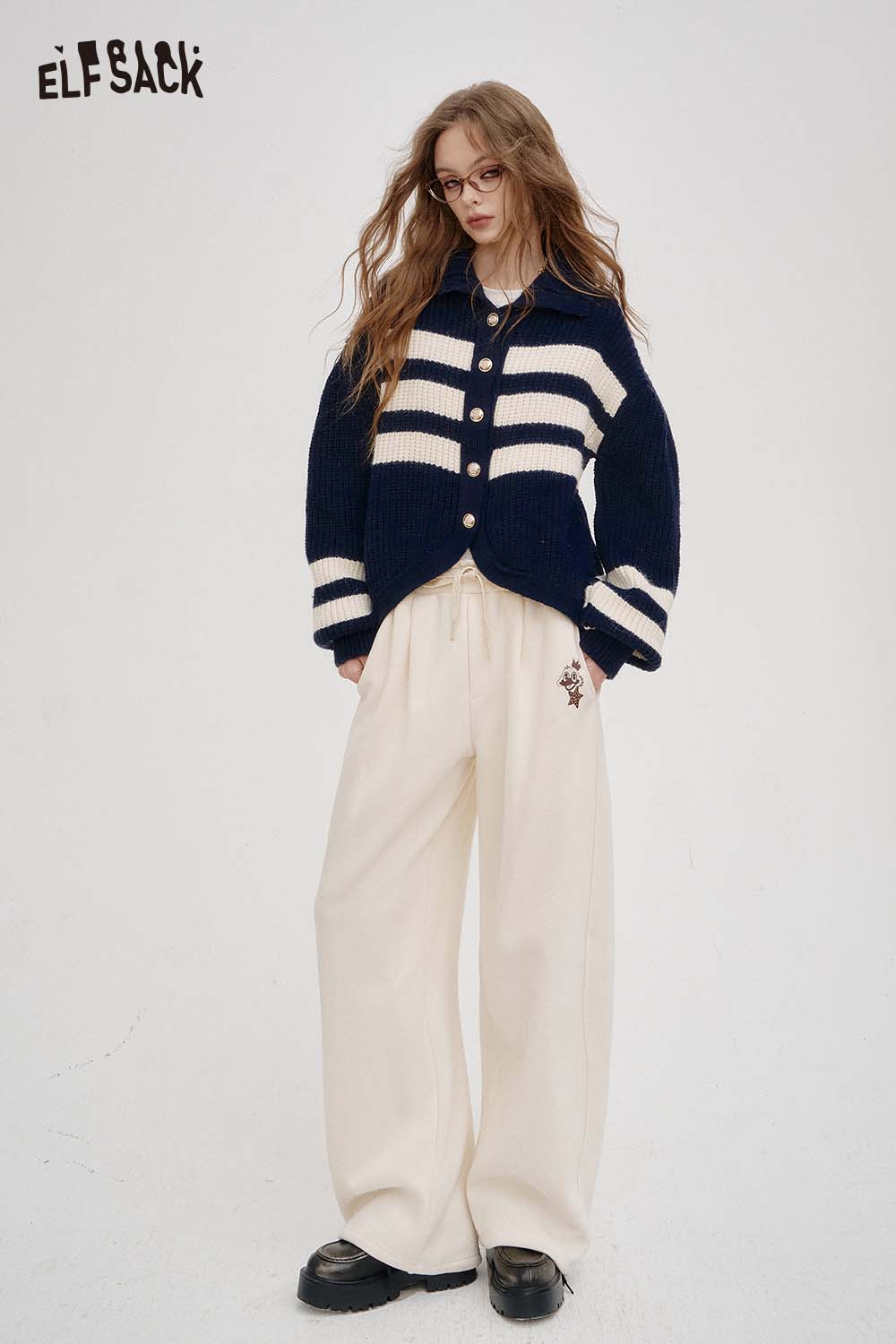ELFSACK women's solid color straight leg pants in cream, paired with a navy striped cardigan