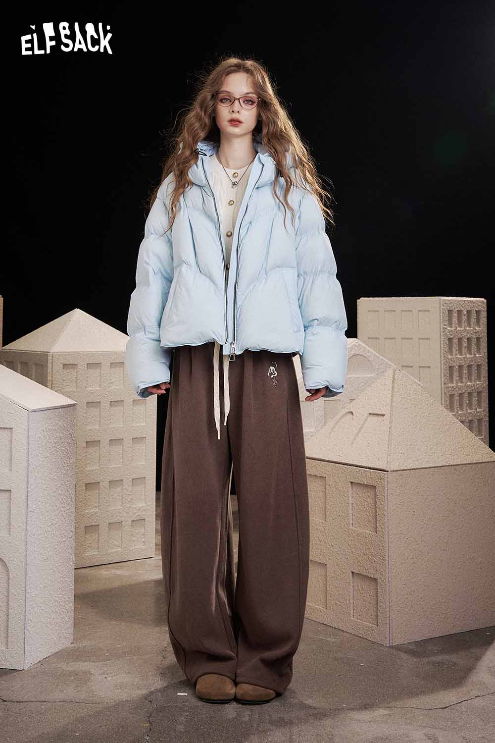 Model wearing ELFSACK women's solid color straight leg pants with a trendy puffer jacket and casual style