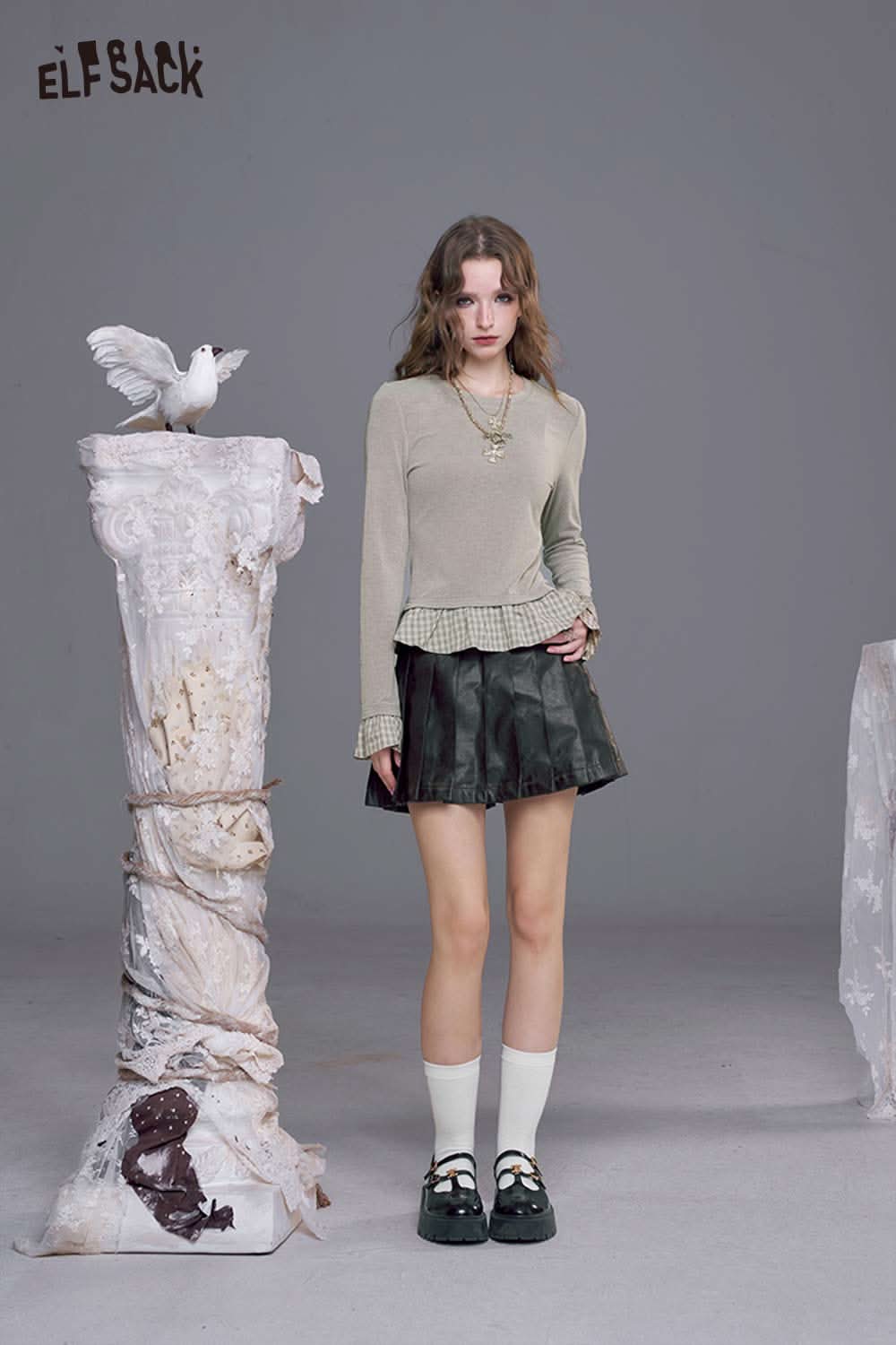Stylish ELFSACK slim fit plaid panel tee for women paired with a chic skirt and accessories