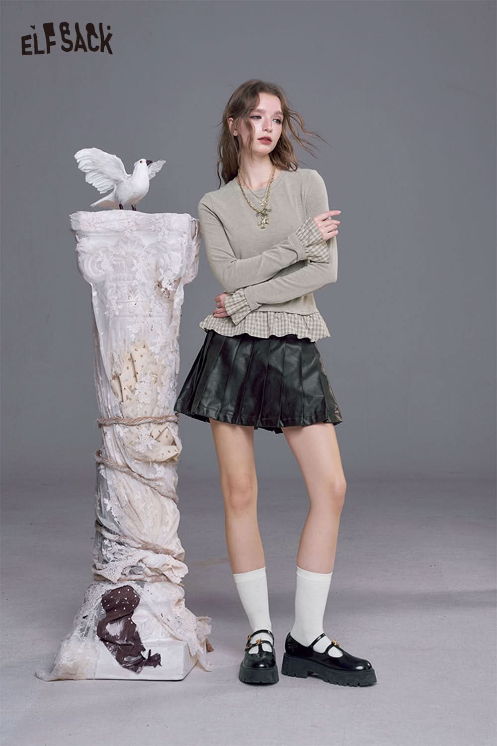 ELFSACK slim fit plaid panel tee for women styled with a layered skirt and trendy accessories